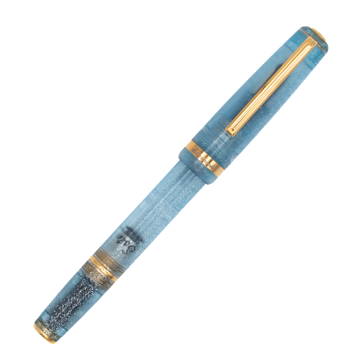 A light blue transparent fountain pen with silver glitter accents along the barrel, gold trim, a gold nib. The pen is shown diagonally on a plain white background.