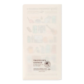 A translucent cream-colored folder with the text 'TRAVELER'S notebook' near the bottom, shown against a plain white background.