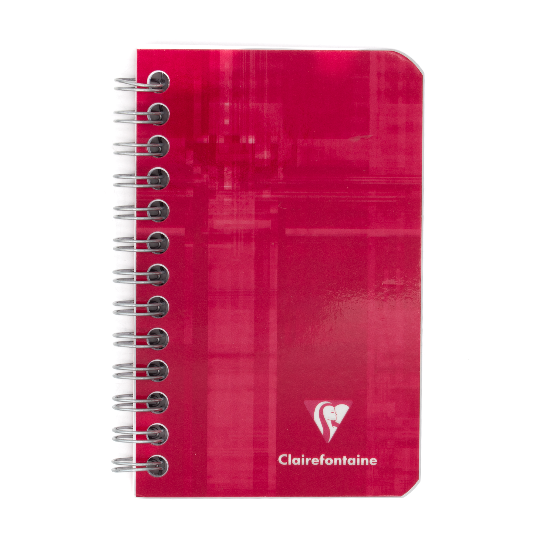 A red side wirebound notebook with the Clairefontaine logo located in the bottom right corner on a white background.