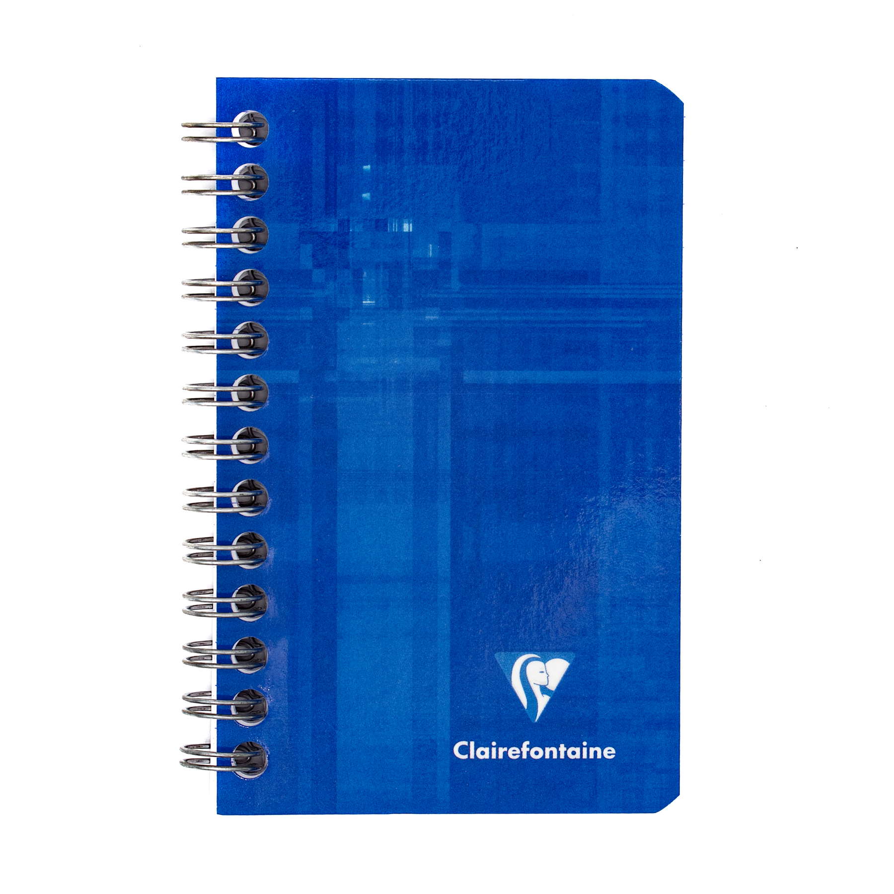 A blue side wirebound notebook with the Clairefontaine logo located in the bottom right corner on a white background.