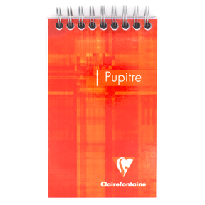 An orange top wire bound notepad with text that says 'Pupitre' and the Clairefontaine logo located in the bottom right corner of the cover. 