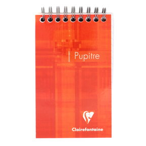 An orange top wire bound notepad with text that says 'Pupitre' and the Clairefontaine logo located in the bottom right corner of the cover. 