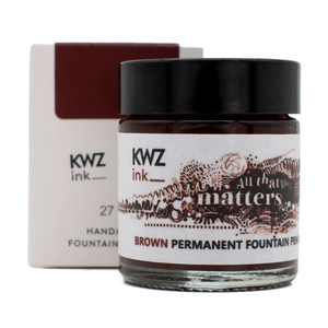 30 ml bottle of KWZ 'All That Matters' brown permanent ink in front of the product box with a white background.