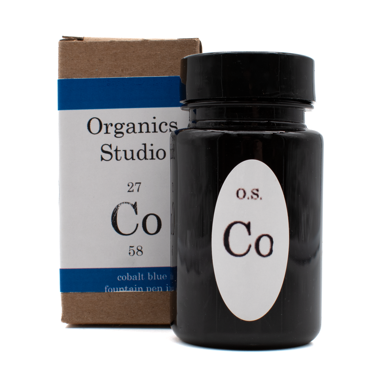 A bottle of Organics Studio 'Cobalt Blue' in front of its brown box with a white and blue label and black text on a white background.