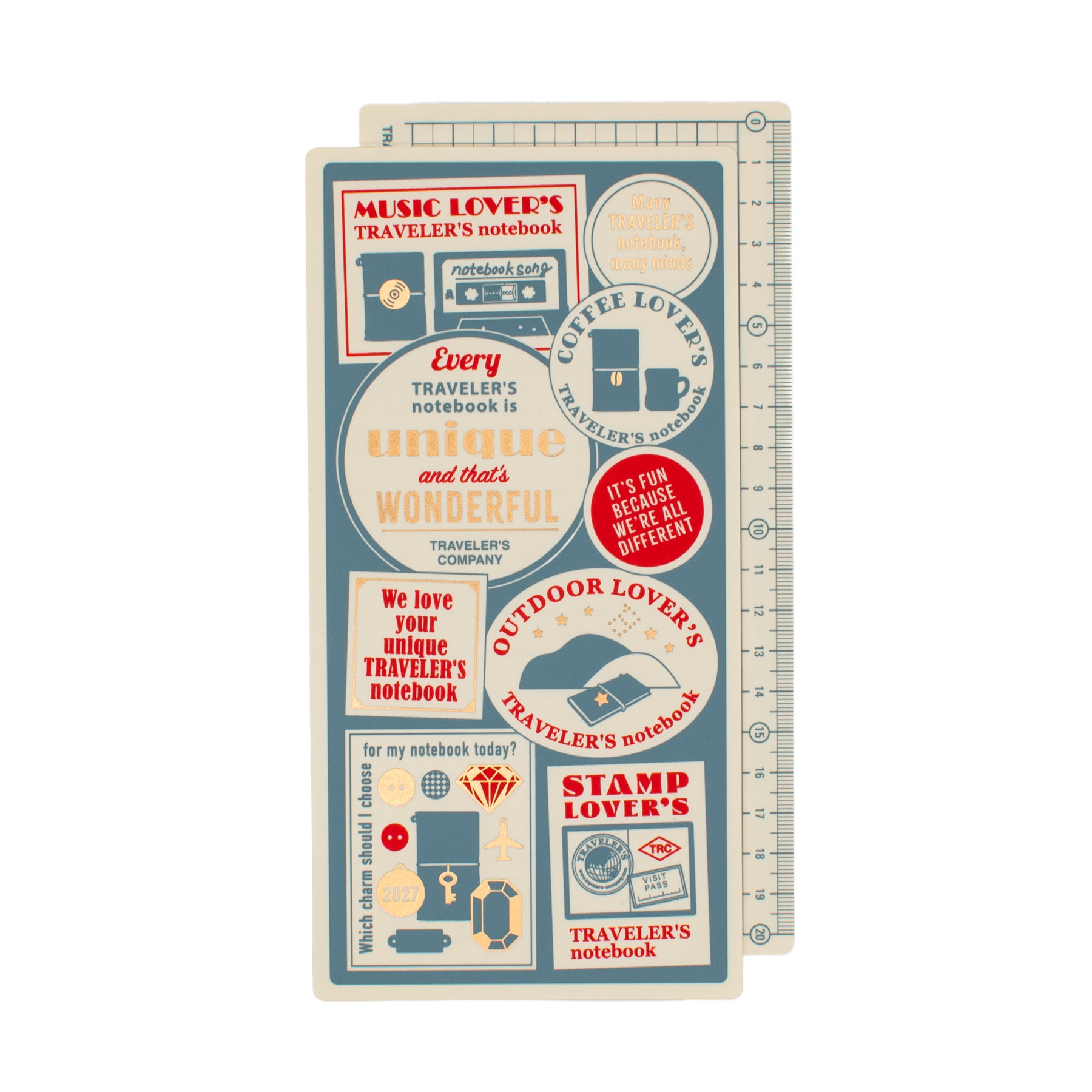 Two regular sized pencil boards stacked with cream, muted blue, red, and gold details. The illustrations showcase highlighted elements for the 2027 Traveler's Company theme 'Every Traveler's notebook is unique and that's wonderful'-- 'music lover's' 'coffee lover's' 'outdoor lover's' 'stamp lover's' are written with the illustrations. The pencil boards are on a plain white background.