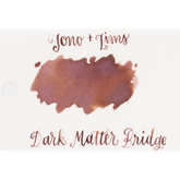 A dual shaded ink swatch in a brown and lavender on white paper, with the text 'Tono+Lims' at the top and 'Dark Matter Bridge' at the bottom in matching script on a plain white background.