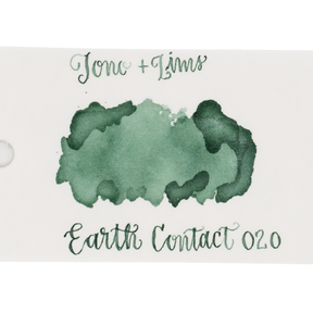 An ink swatch in jade green on white paper, with the text 'Tono+Lims' at the top and 'Earth Contact 020' at the bottom in matching green script on a plain white background.