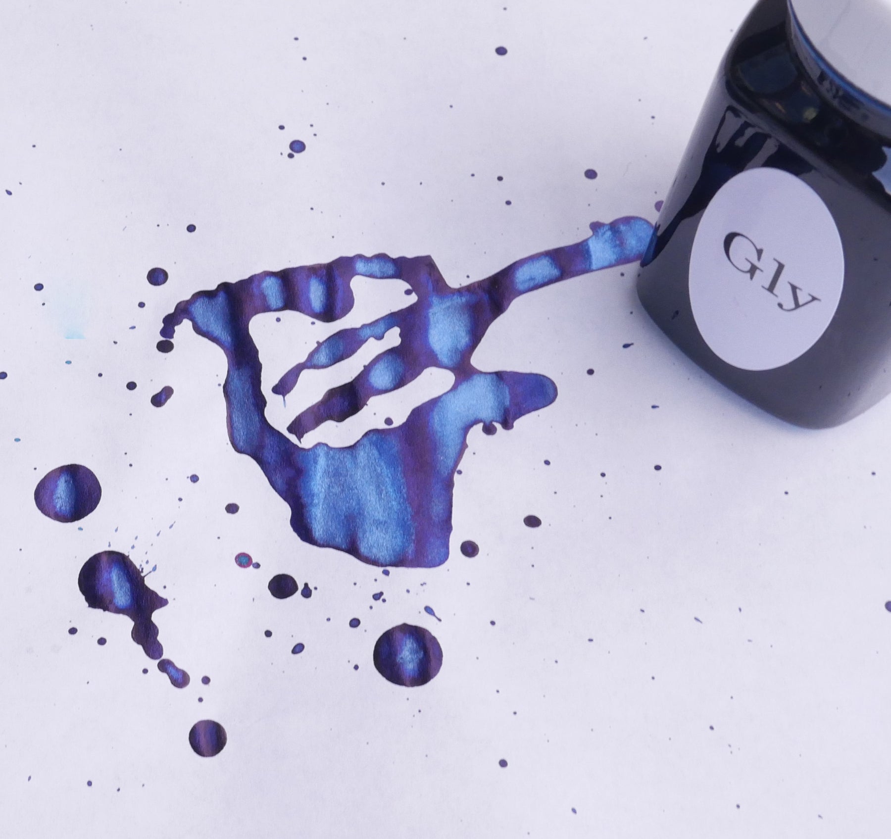 Fountain pen ink from Organics Studio, handmade in Maryland. If you are seeking a good sheening fountain pen ink, then this is for you! A Royal blue ink, with strong red to purple sheen even with less than fountain pen friendly paper.