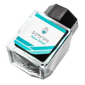 3 Oysters Aqua Green from the Delicious collection is a vibrant blue-green fountain pen ink with medium shading and a pop of pink sheen in large swabs. It dries in 40 seconds in a medium nib on Rhodia and has an average flow. The glass bottle has a cut out corner to lean the bottle for a decorative display. 3 Oysters ink is made in Korea.  Pantone color: 3272C