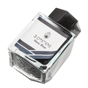 3 Oysters Navy Blue from the Delicious collection is a medium blue-black fountain pen ink with medium shading and high pink sheen. It dries in 30 seconds in a medium nib on Rhodia and has a dry flow. The glass bottle has a cut out corner to lean the bottle for a decorative display. 3 Oysters ink is made in Korea.  Pantone color: 2188C