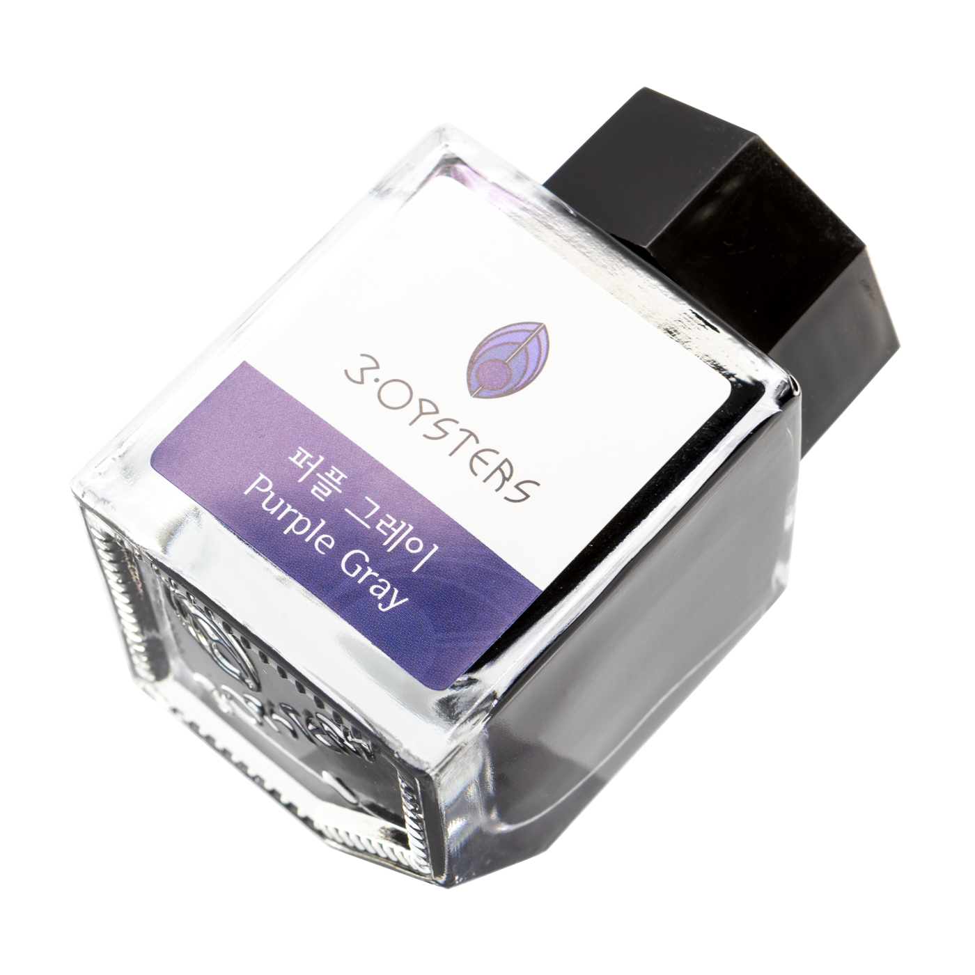 3 Oysters Purple Gray from the Delicious collection is a dark cool-tone purple fountain pen ink with low shading. It dries in 30 seconds in a medium nib on Rhodia and has a dry flow. The glass bottle has a cut out corner to lean the bottle for a decorative display. 3 Oysters ink is made in Korea.  Pantone color: 5275C